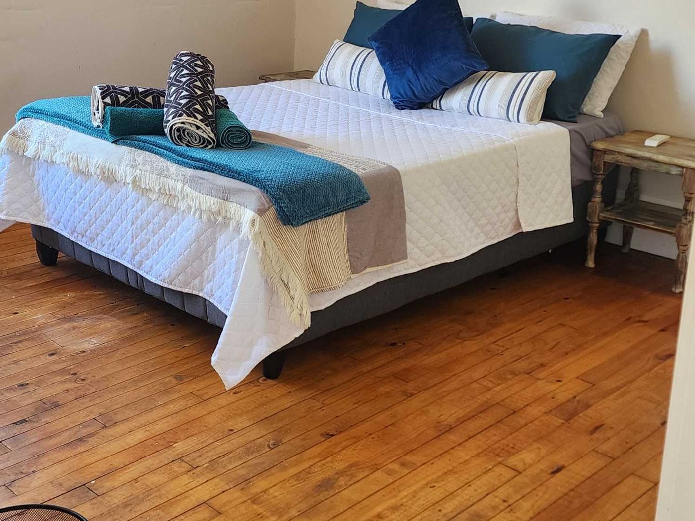 Double bedroom with timber floor and air conditioning